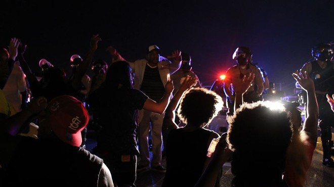 Protesters in Ferguson face police in riot gear in the days after Michael Brown's death.