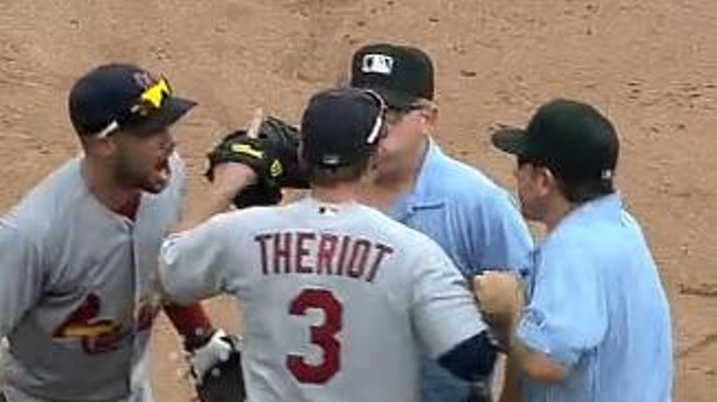 Theriot gets into it with umpires yesterday in Cincinnati.