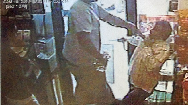 Ferguson police say this image shows Michael Brown roughing up a convenience-store owner just prior to an officer shooting the suspect.