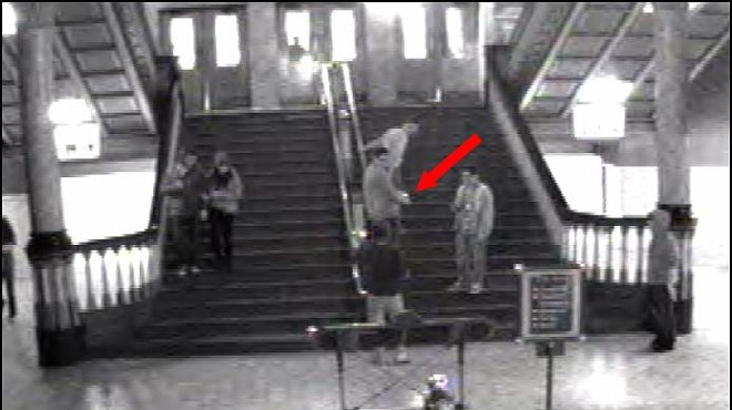This punk -- possibly drunk from St. Paddy's Day -- is stealing a historic finial from Union Station.