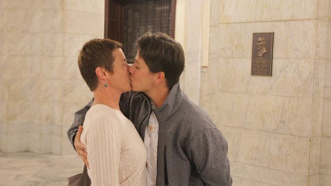 Crystal Peairs and April Breeden kiss after marrying in the St. Louis City Hall rotunda Wednesday.
