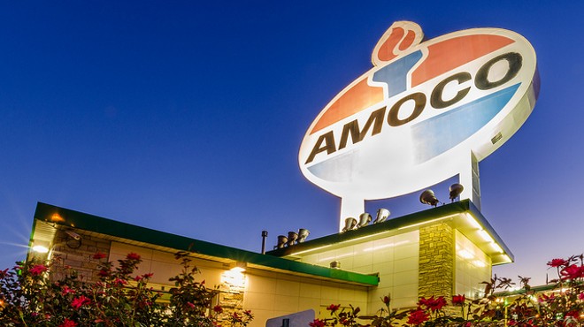 The gas prices are as small as the Amoco sign is large.
