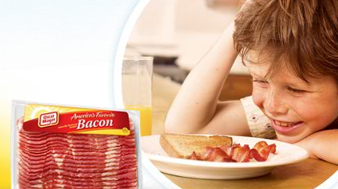 Here's a kid absolutely in love with bacon. Just look at him.