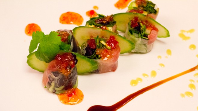 The Chrystal Roll with tuna, yellowtail, cilantro, jalapeno and cucumber rolled in rice paper with eel sauce, sweet chili sauce and avocado sauce.