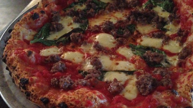 Sausage pizza with mozzarella, tomato and basil. | Nancy Stiles