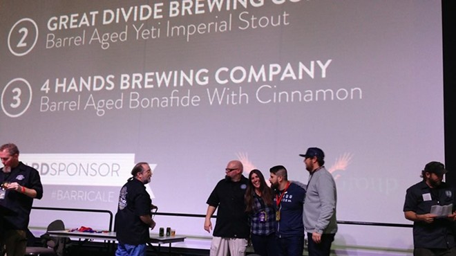 4 Hands accepts medal for the Barrel Aged Bona Fide with Cinnamon.