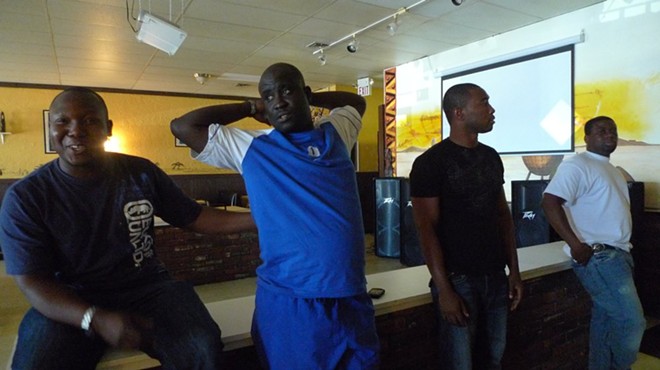 Tam Tam owner Kassim Kone (left) and some of the Ivory Coast contigent