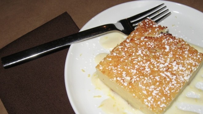 Crustless Buttermilk pie with lemon creme anglaise and lemon zest.