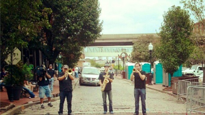 A horn section (the Blue City All-Stars?) plays on Second Street on Saturday afternoon.