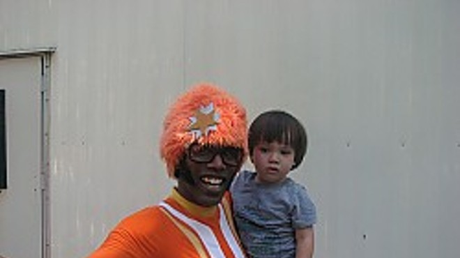 DJ Lance Rock with a young fan. Awwz.