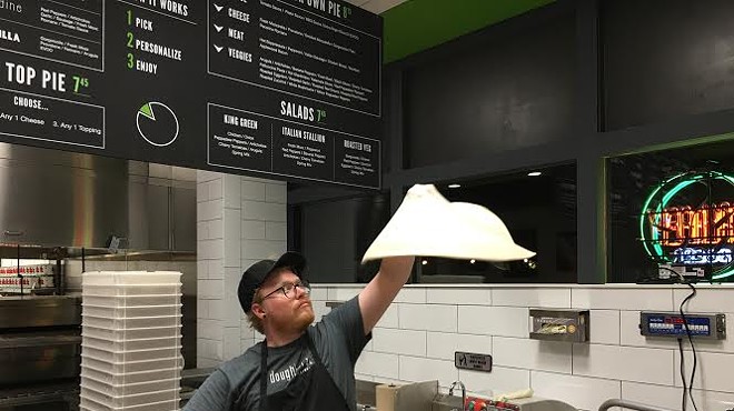 A pizzaola hand-tosses the dough to order.