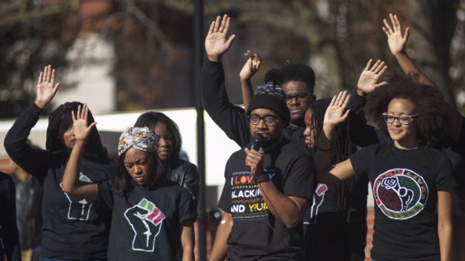 "How Mizzou responds to the threat on Black lives today will dictate the progress of the school for the next 10+ years," grad student Jonathan Butler, center, tweeted on November 11.