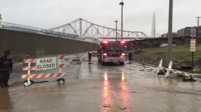 St. Louis firefighters had to rescue men on Monday from a tent encampment near a Leonore K. Sullivan Boulevard flood wall.