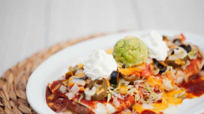 Hacienda's signature "wet burrito" comes smothered in cheesy sauce.
