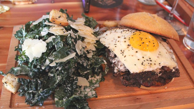 The farmhouse burger with kale Caesar salad.