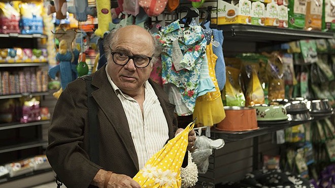 Danny DeVito contemplates buying dog clothes while his life circles down the drain.