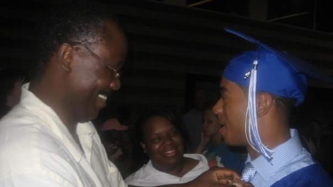 Jordan Nichols, currently serving 15 years in prison, shown here after his high school graduation with his mother and stepfather.