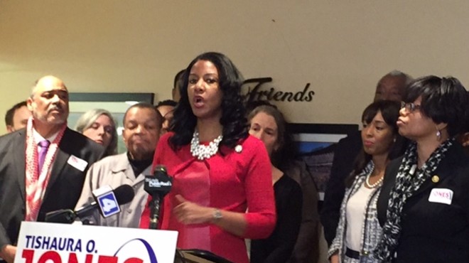Flanked by supporters including state Rep. Cora Faith Walker (right) and state Sen. Jamilah Nasheed (far right), Tishaura Jones addresses the press.
