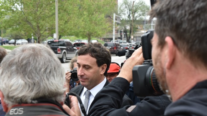 Ex-St. Louis County Executive Steve Stenger makes his way through reporters after pleading guilty to federal felonies.