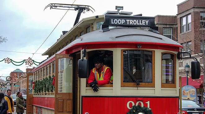 A worker on a packed Delmar Trolley on Sunday.