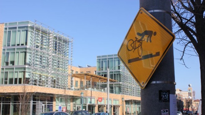 Signs warn cyclists of the dangers posed by the Loop trolley.