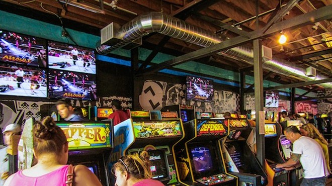 Customers enjoy Minneapolis' Up-Down Arcade Bar.