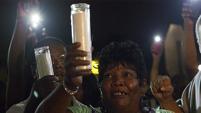 Annie Smith at a candlelight vigil for her son Monday night.