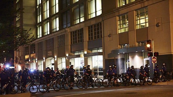 Cops gather outside police headquarters on Sunday, September 17.