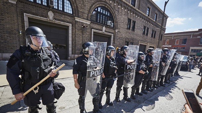 Police hold a line downtown on Friday, September 15.