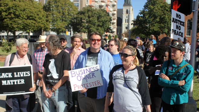 Eliza Coriell, far right, and other business owners joined Friday's protests.