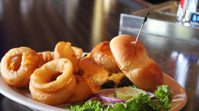 The Schlafly Pale Ale Burger comes topped with a molten beer cheese and an onion ring.