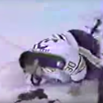 A wounded Clint Malarchuk gushes blood on the ice.