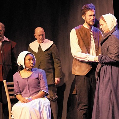 John and Elizabeth Proctor (Graham Emmons and Cynthia Pohlson, right) pray their servant Mary (Chrissie Watkins, seated) doesn't turn on them in court.