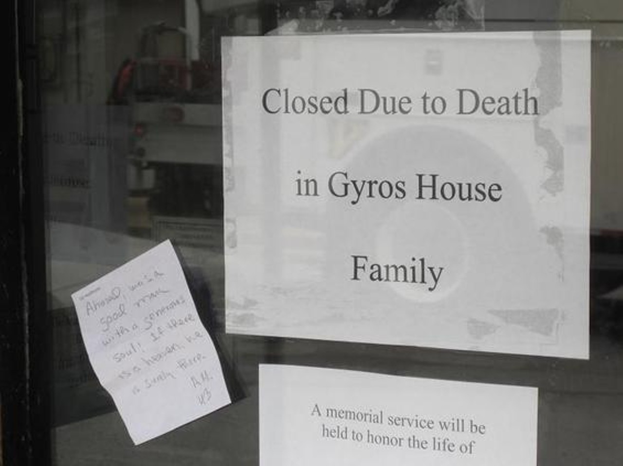 This sign was posted after the recent death of Ahmed Eltawmi, 50, who owned the Gyro House in the Delmar Loop. Eltawmi was shot and killed on June 4, 2010  outside his apartment in Maplewood. Customers, family and friends placed flowers next at the foot of the door outside the business. Read more about this story.