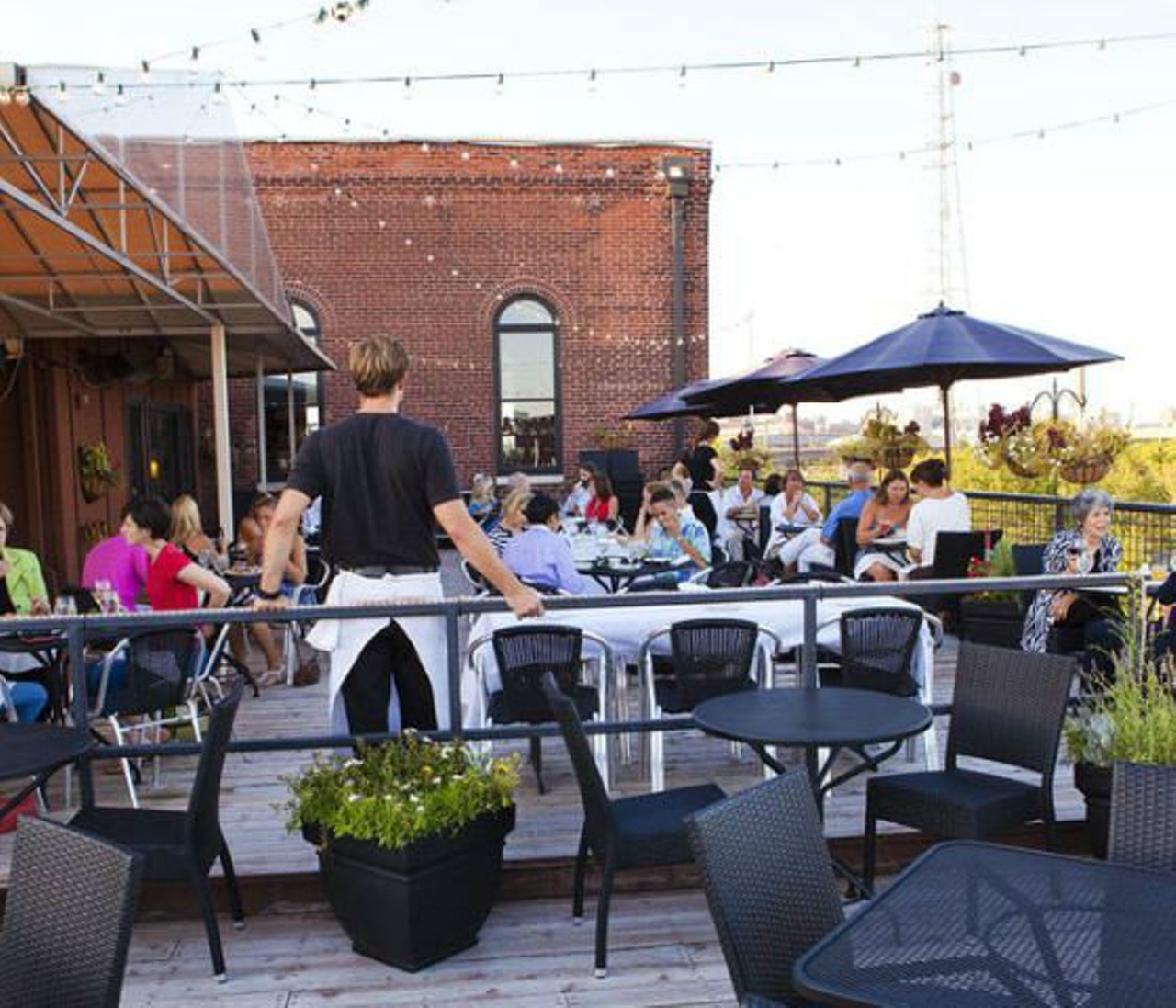 Vin de Set
2017 Chouteau Ave. 
St. Louis, MO 63103
(314) 241-8989
What better place to do some day drinking than on a rooftop? Those who don't dig dive bar atmospheres can find a more upscale place to drink at Vin de Set, home to French cuisine, a full bar and one of the best rooftop patios in the city. Bar hours vary by the day, but Tuesday through Friday it opens at 11 a.m., and on Sunday it opens at 2 p.m. -- meaning you can relax with your drink with plenty of daylight to boot. Photo by Laura Miller.