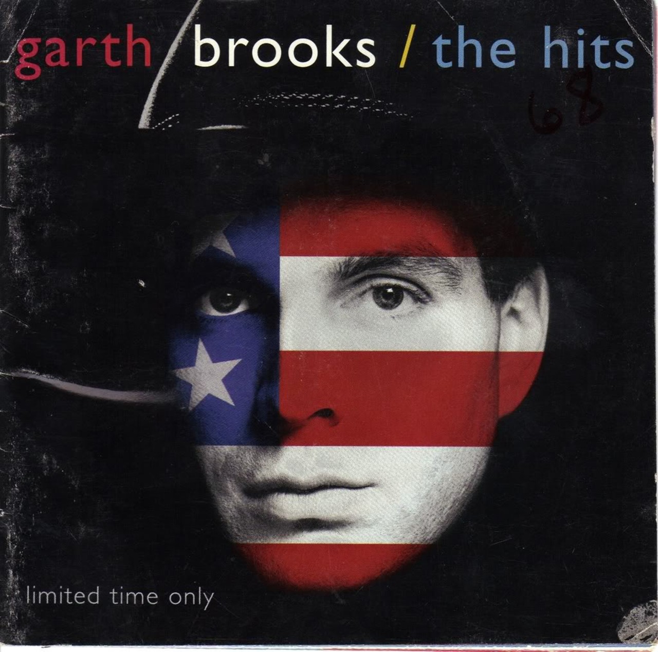 Garth Brooks - The Hits (1994)
1994's The Hits has Garth Brooks' face covered in the colors of the American flag and honestly, it's a little creepy. He looks a little like an alien, with those wide-open unblinking eyes. Conversely, the songs on this record -- "Friends in Low Places" -- have become downright iconic in country bars and un-air-conditioned gas stations across the South.