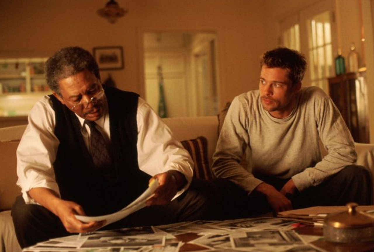 Se7en  (1995)
David Fincher's serial-killer classic pairs Morgan Freeman with Brad Pitt, veteran with younger detective. An unconventional buddy cop movie in that it holds generally strong reviews and doesn't feature a single scene where the duo walk away from an explosion in slow-motion, Se7en's true attraction is the bad guy.