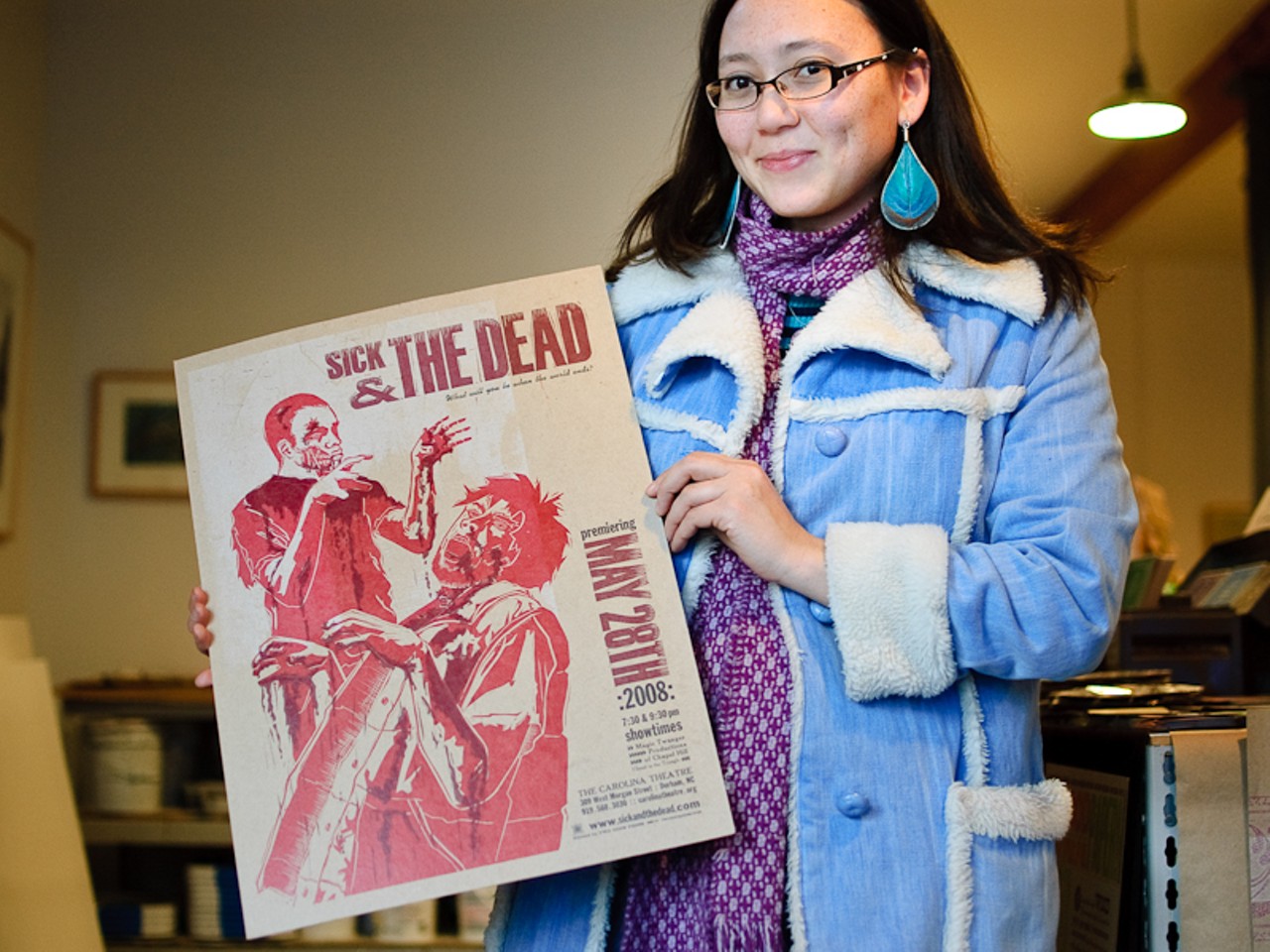 Michelle Dreher shows off her print &ldquo;Sick & The Dead.&rdquo; Surprisingly, this isn&rsquo;t the only zombie print on display on Cherokee &ndash; or even in the building