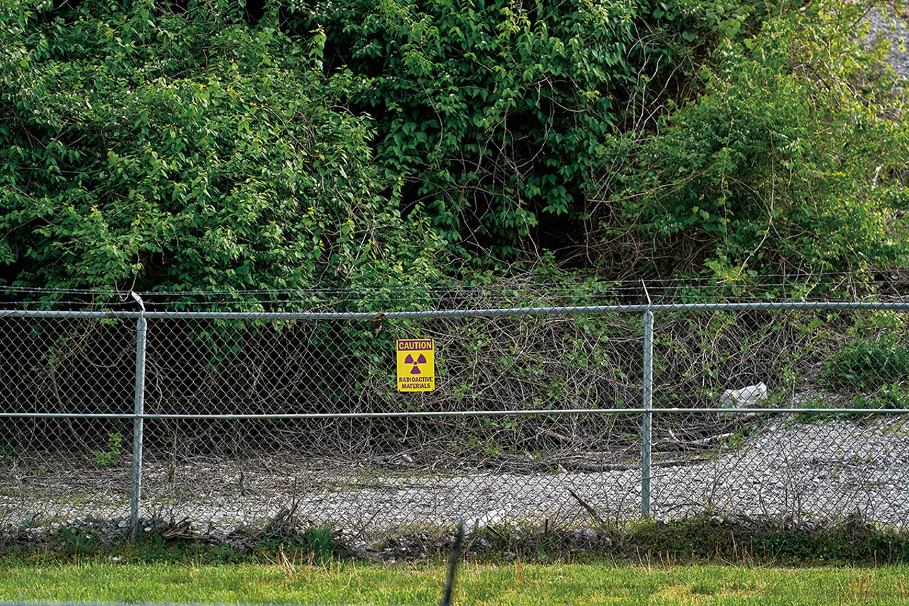 A sign warns of radioactive material at the West Lake Landfill. Thousands of tons of nuclear waste from the Manhattan Project were dumped there in the 1970s.