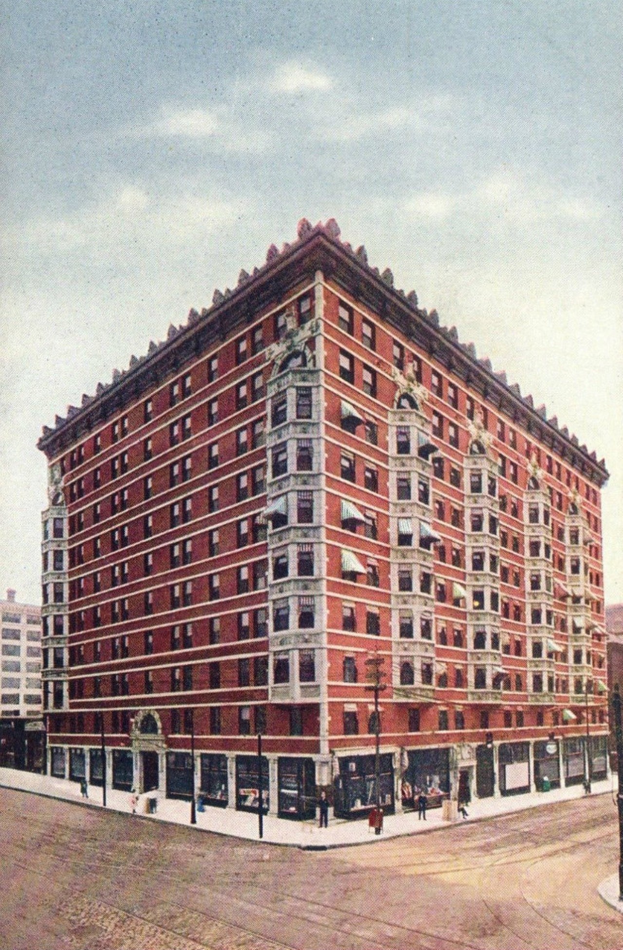 Spend a night at Marquette Hotel.
Later known as the Milner Hotel, the ten-story brick building that once stood at the southeast corner of 18th and Washington opened as the Marquette Hotel in 1907. Built to serve dry goods companies that once thrived on the western edge of downtown St. Louis, the Marquette stood for eighty-one years. Designed by the prominent St. Louis architectural firm Barnett, Haynes, and Barnet, the Marquette stood ten stories tall and featured rich terra cotta ornament designed by noted sculptor George Julian Zolnay. Despite being listed on the National Register of Historic Places, the hotel was torn down in 1988 and replaced with a parking lot.Photo courtesy of Cameron Collins.