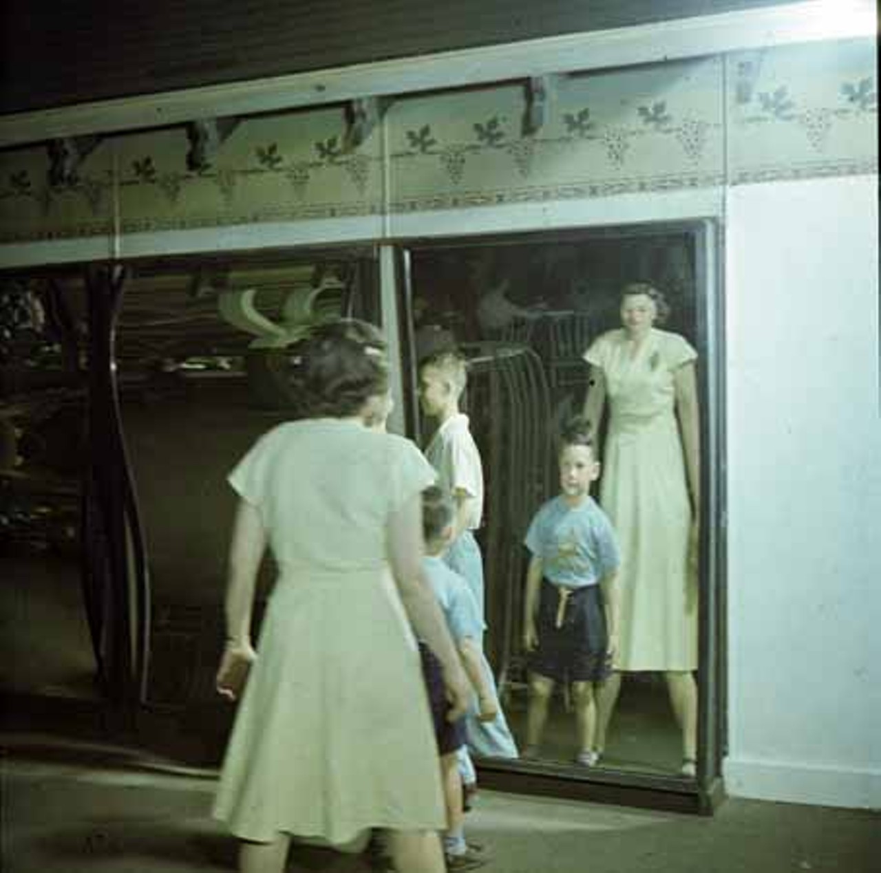 1947. Visitors get a kick out of the fun house mirrors.