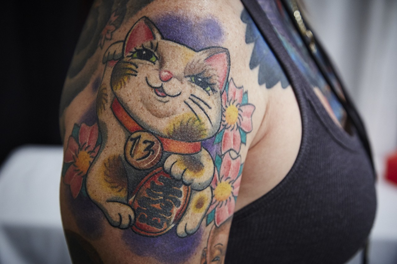 This kitty tat lives on the arm of Jamie Haas, a Dallas-area tattoo shop owner.