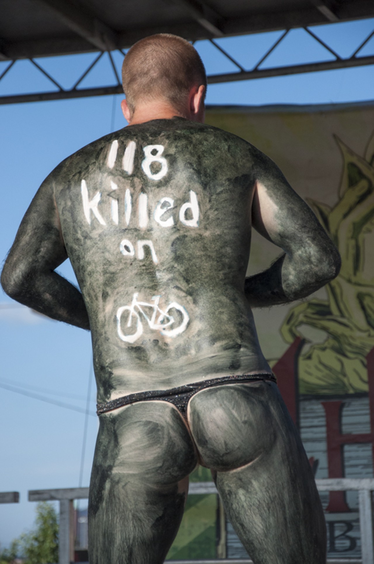 A contestant raises awareness on the vulnerability of cyclists during the costume contest at 2015 World Naked Bike.