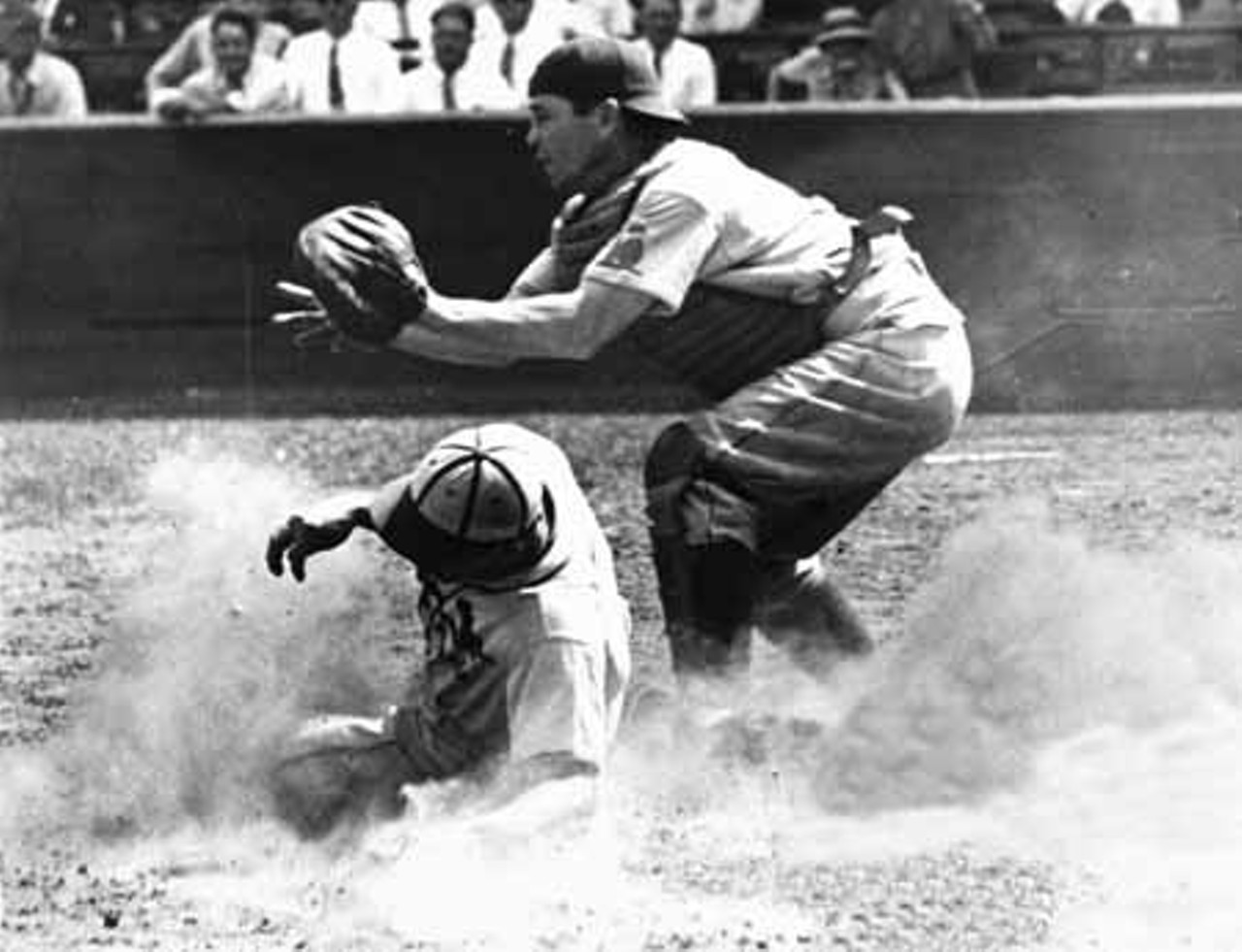 1938. Don Gutteridge is safe at home -- too bad for New York Giants catcher Gus Mancuso.