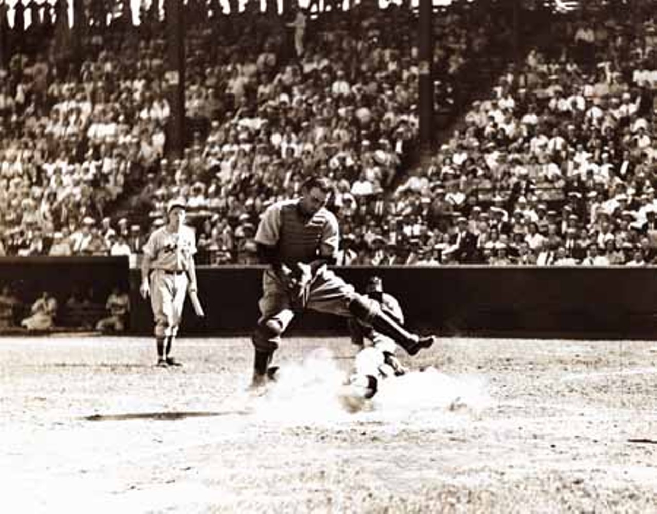 1937. St. Louis Cardinals vs. Philadelphia Phillies. Stuart Martin slides home under Earl Grace, the Phillies catcher.