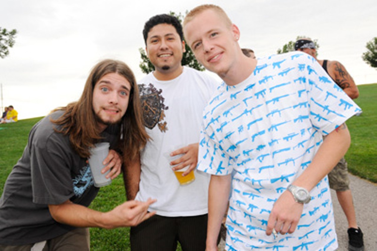 Three 311 fans on the lawn.