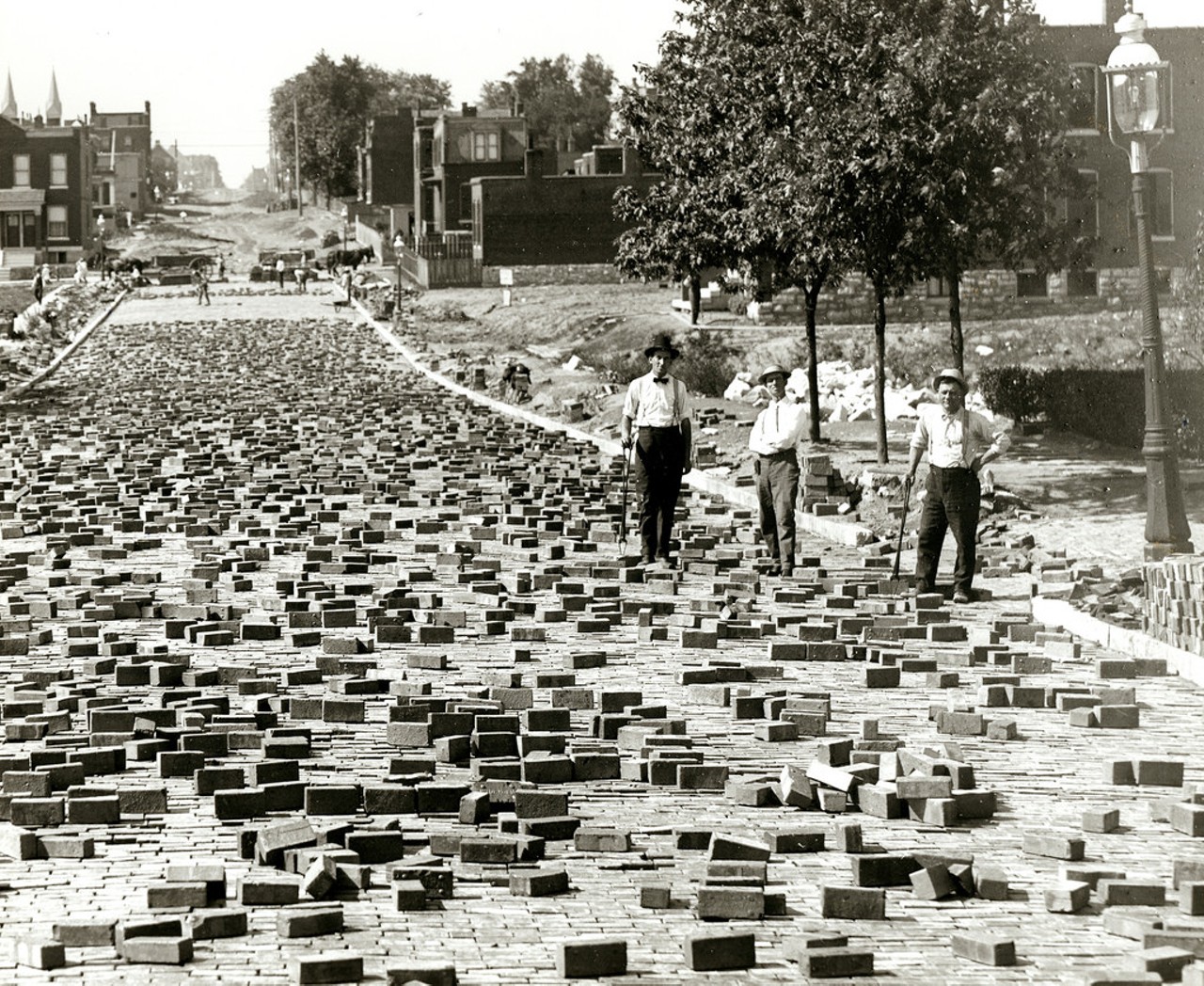 Street pavers at work on Compton Avenue north of Meramec Street, 1906. The distinctive pyramidal towers of St. Anthony of Padua can be seen in the distance at left.