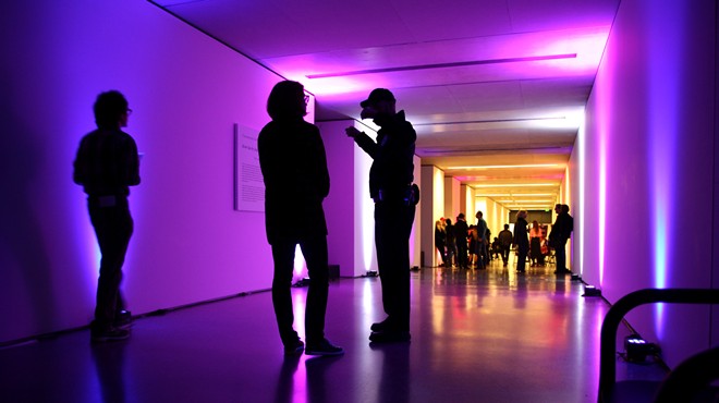 Visitors enjoy a late night event at Saint Louis Art Museum.