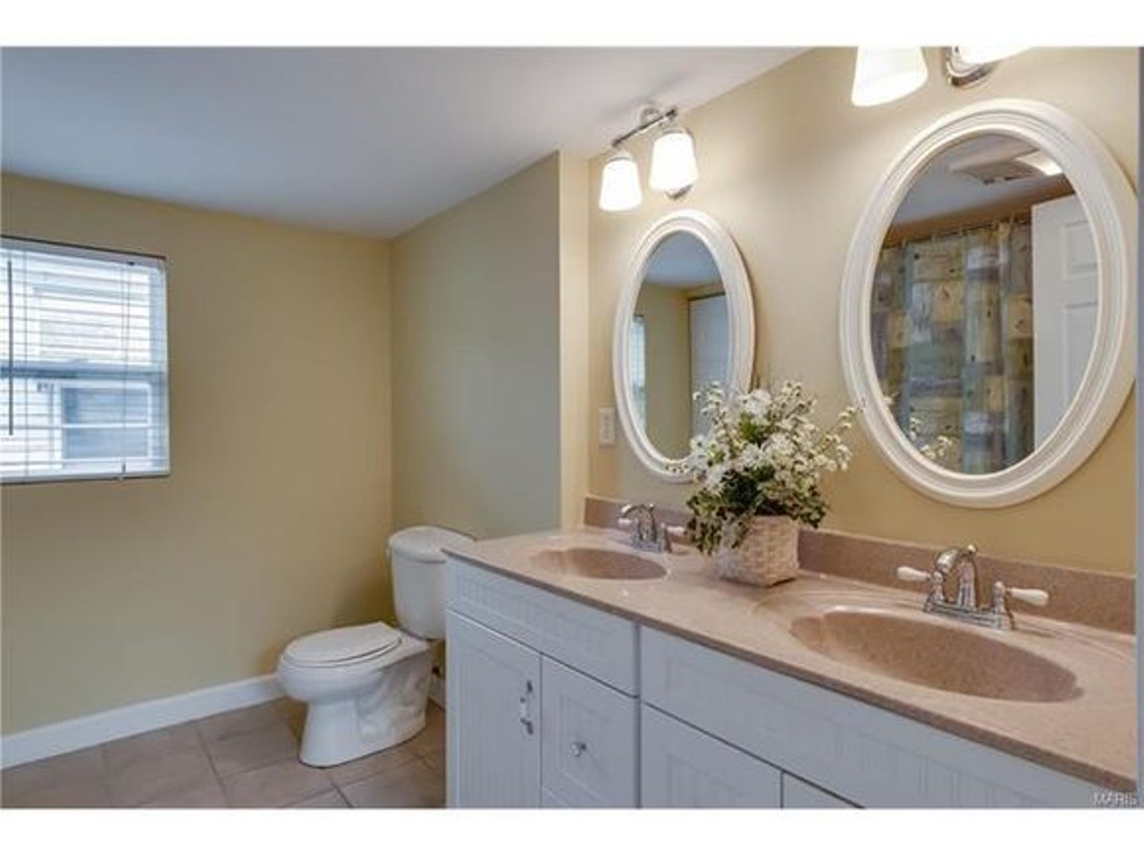 There is a full bath on the second floor as well. It has a double vanity and onyx counter-top.
