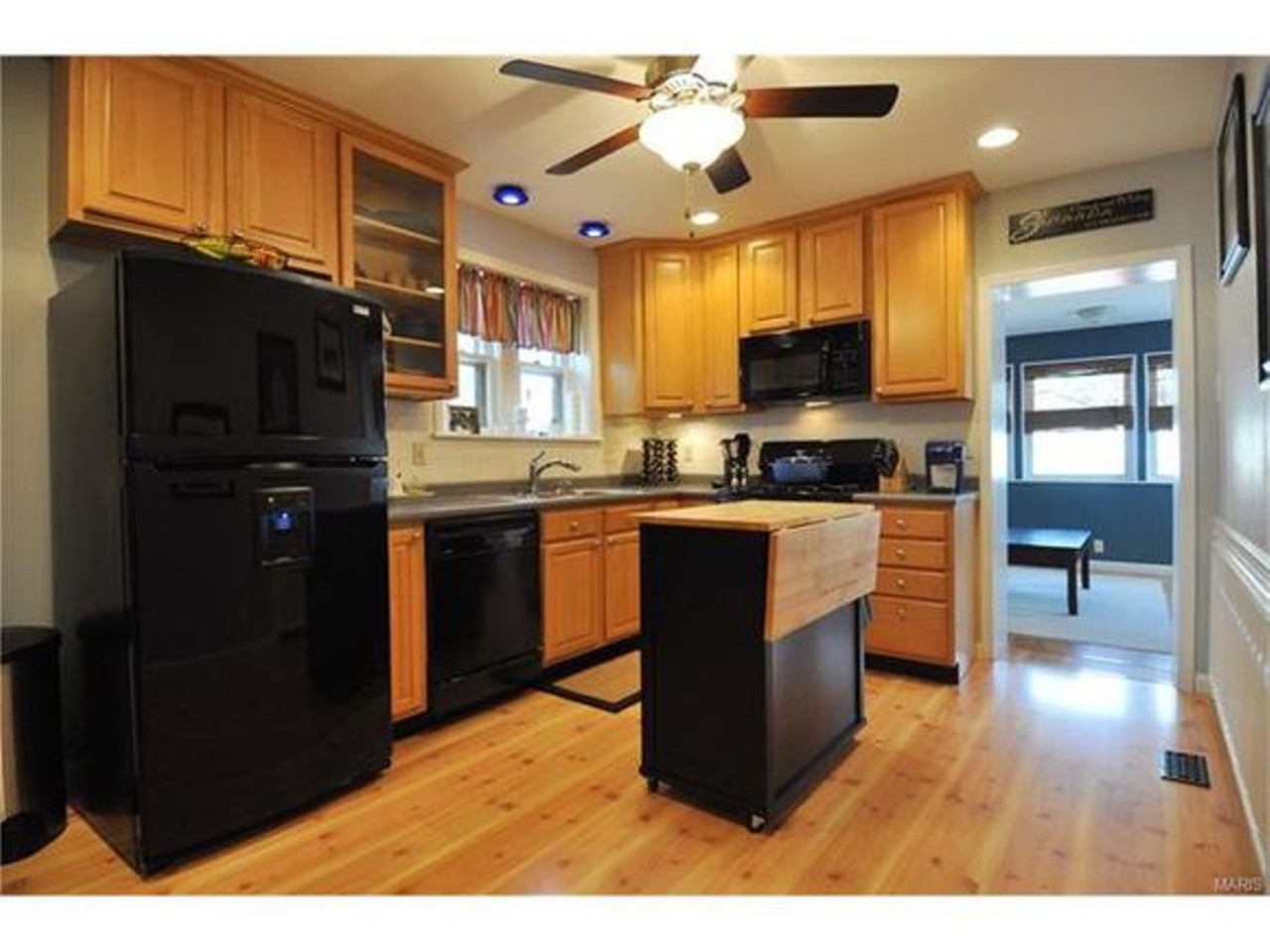 The kitchen features 42-inch maple cabinets.